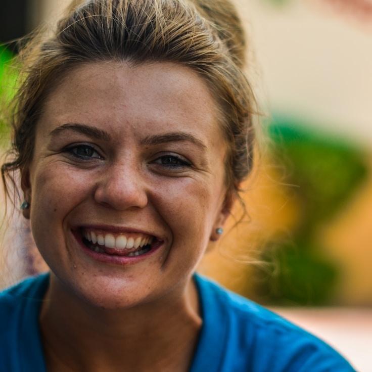 Kaveri Mehta, Lead Design Curator at MeadowBridgeOrbit, reviewing corporate floral arrangements